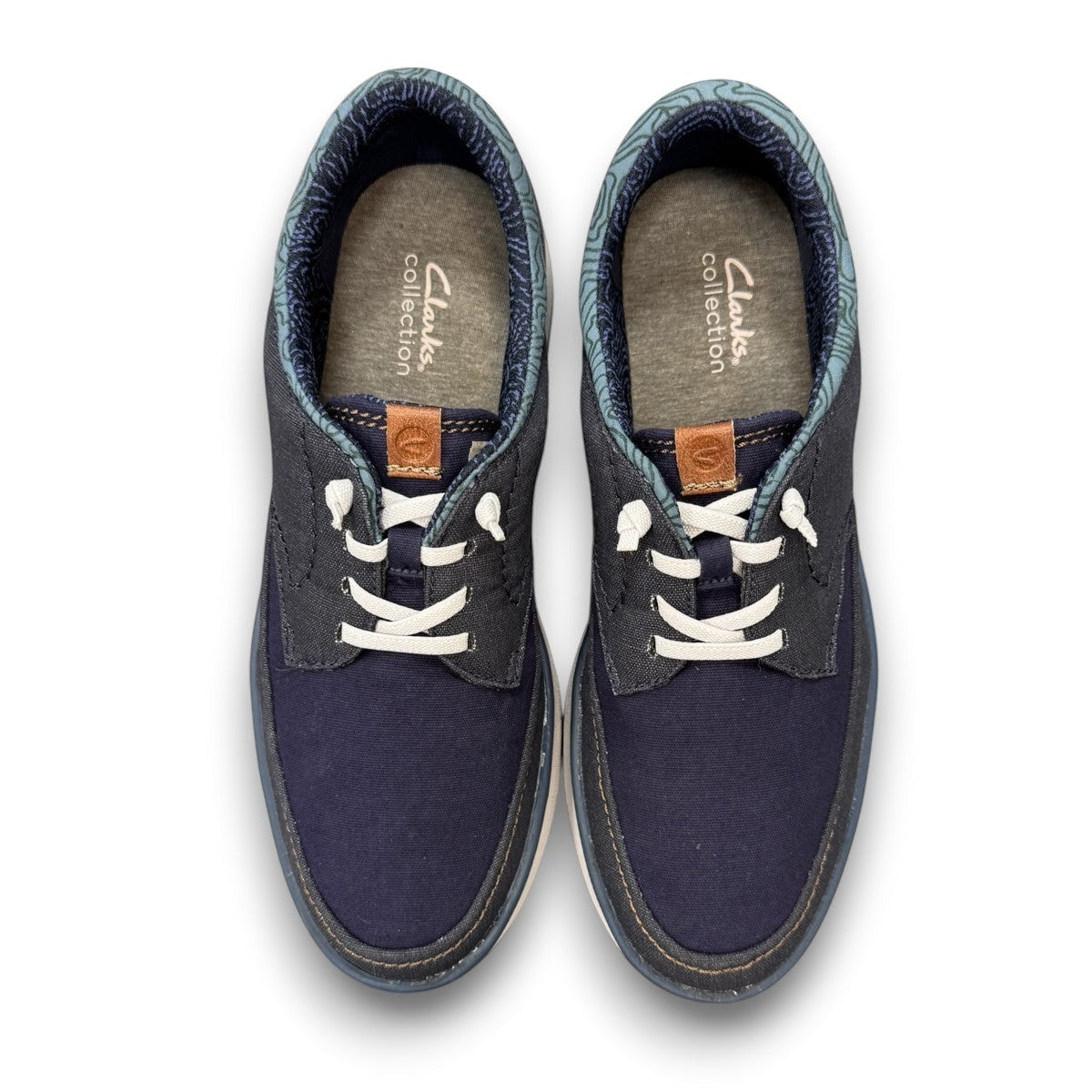 Clarks Cantal Low navy canvas lace-up sneaker with a lightweight EVA sole and patterned collar. top view.
