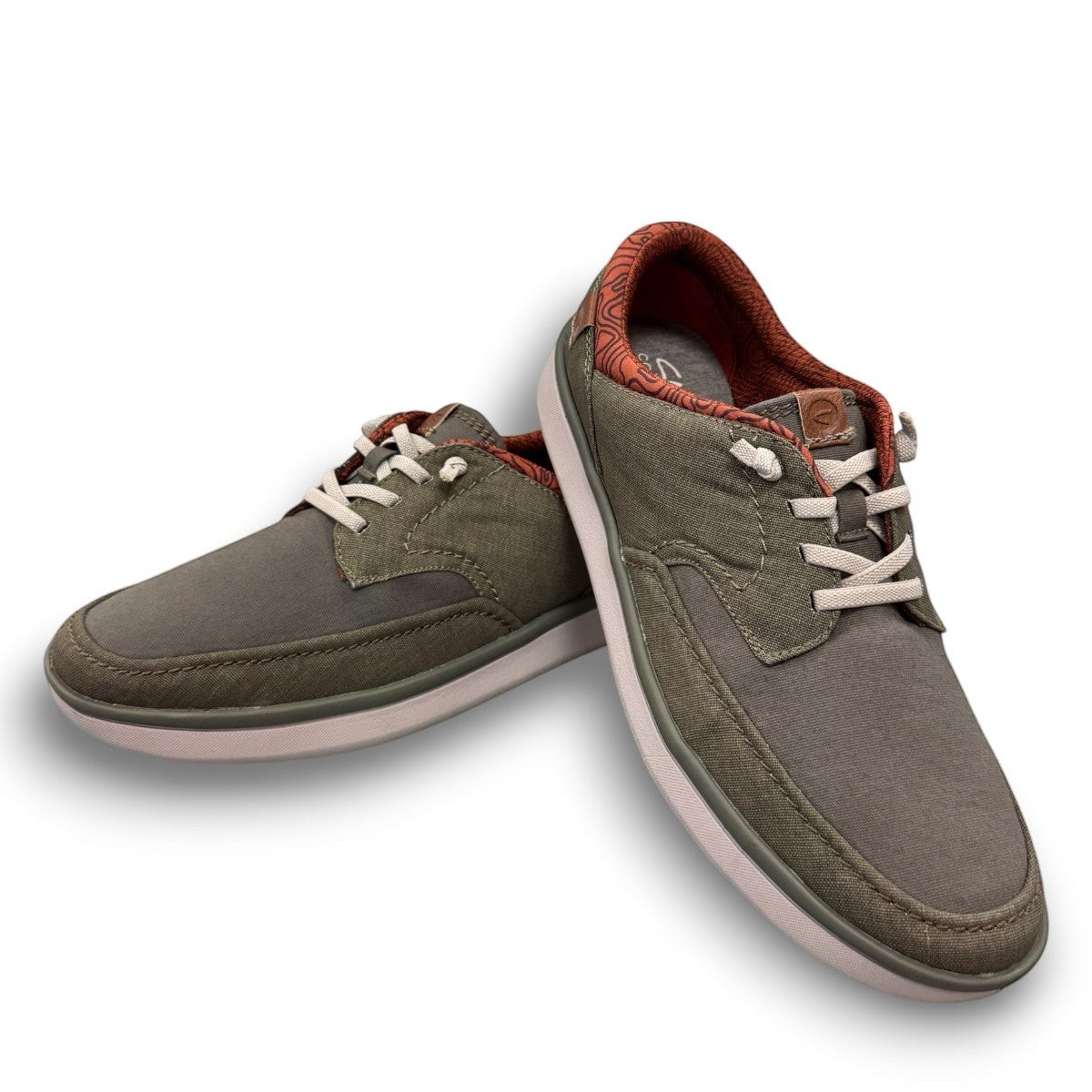 Clarks Cantal Low olive canvas lace-up sneaker with a patterned collar and lightweight EVA sole. front view.