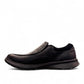 Clarks Cotrell Step men's slip-on shoe in black oily leather with a shock-absorbing rubber outsole. left view.