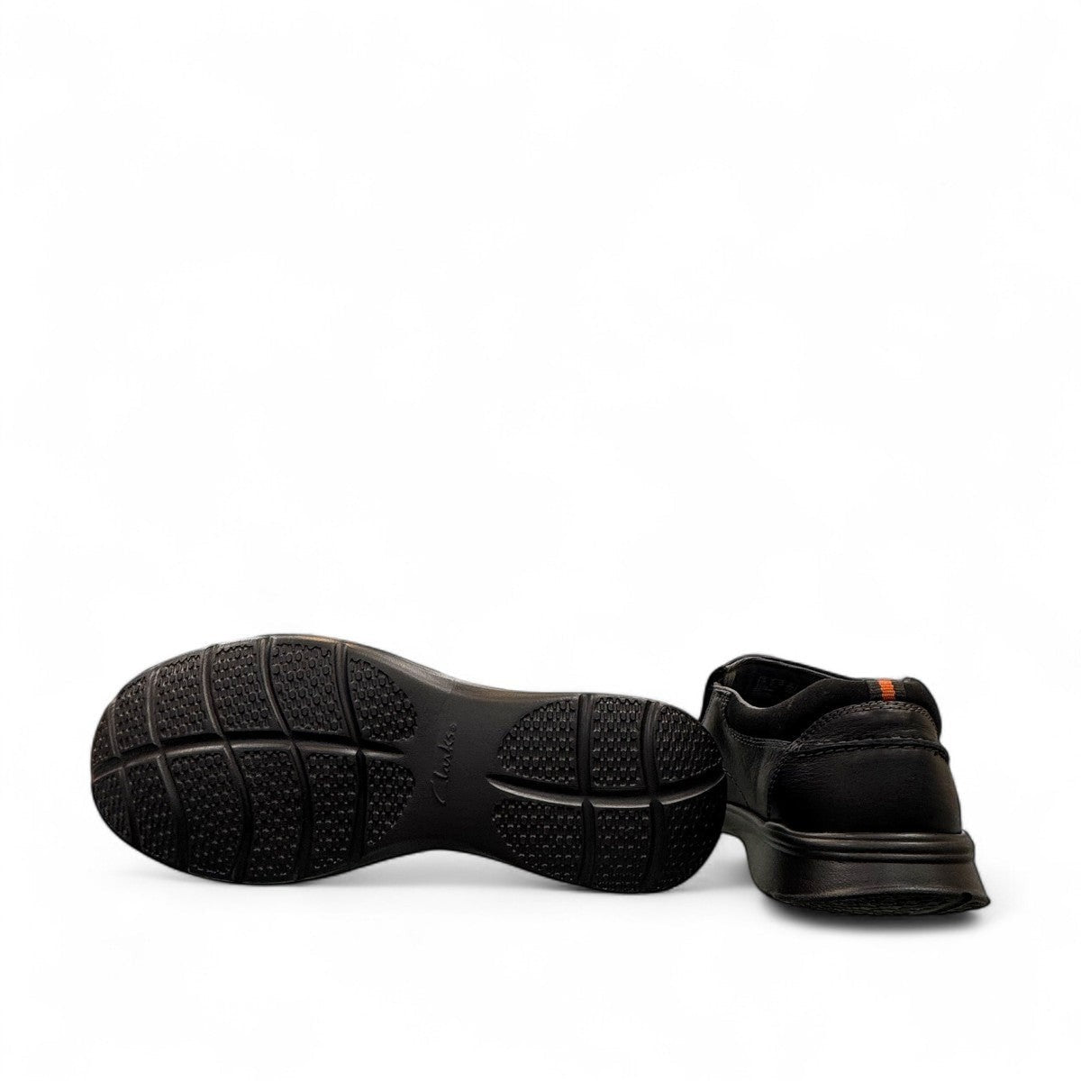 Clarks Cotrell Step men's slip-on shoe in black oily leather with a shock-absorbing rubber outsole. bottom view.