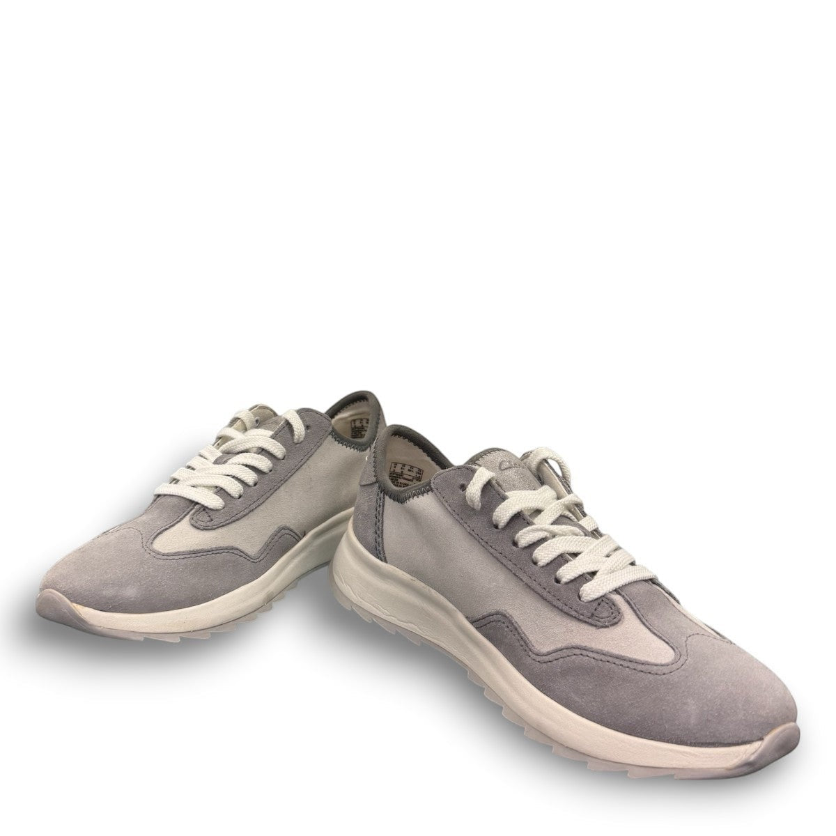 Clarks Dashlite Lo grey suede sneakers with a lightweight EVA midsole and gum rubber sole. photo of the front.