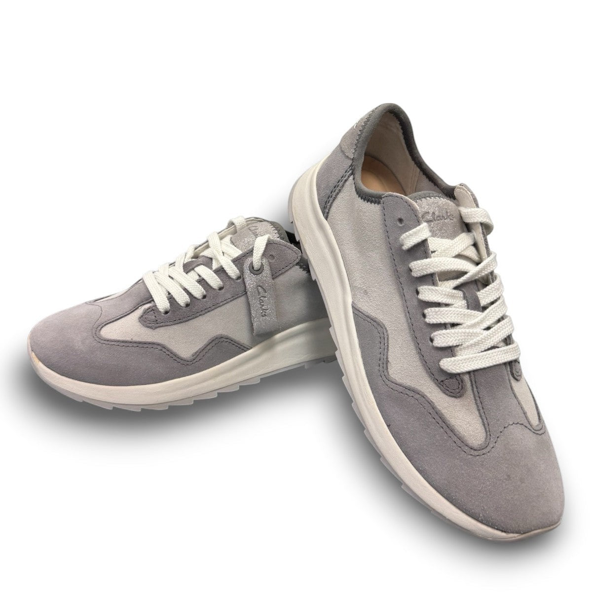 Clarks Dashlite Lo grey suede sneakers with a lightweight EVA midsole and gum rubber sole. photo of the front.