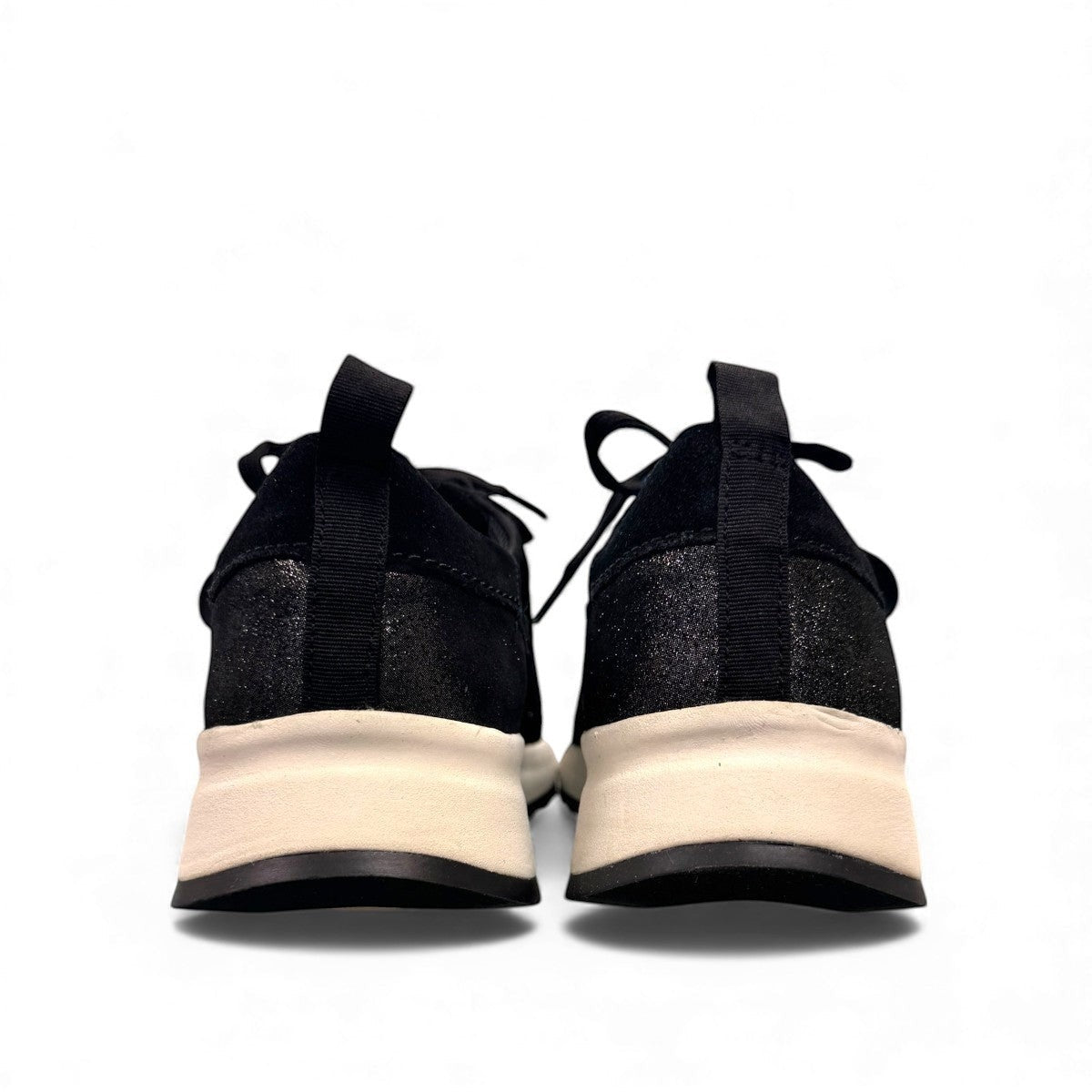 Clarks DashLite Jazz black leather sneaker with glitter accents and a lightweight white EVA midsole. back view.