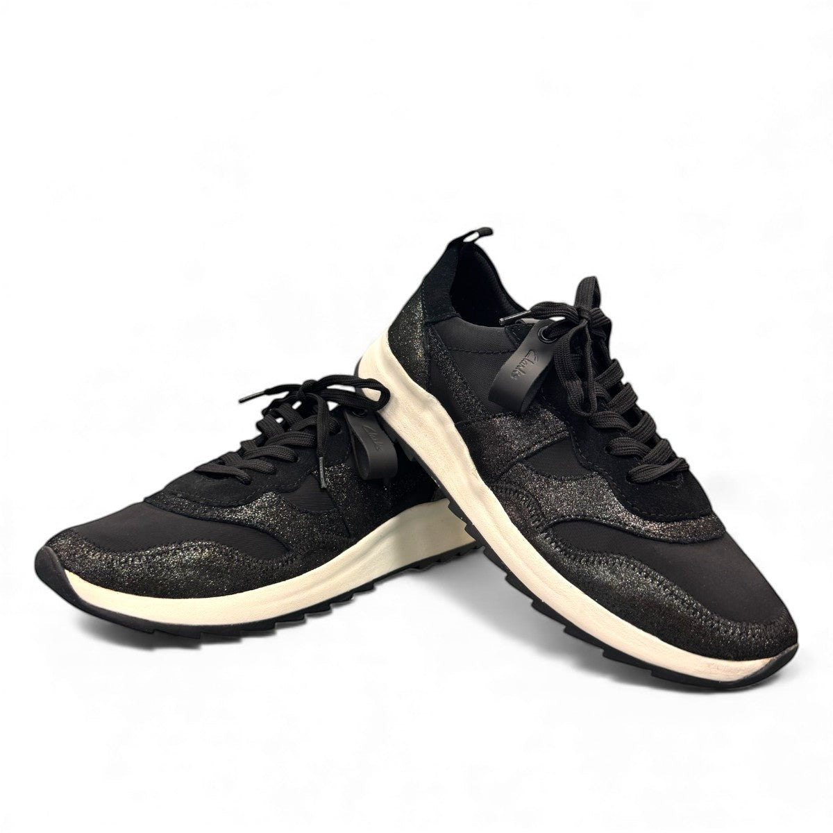 Clarks DashLite Jazz black leather sneaker with glitter accents and a lightweight white EVA midsole. front view.