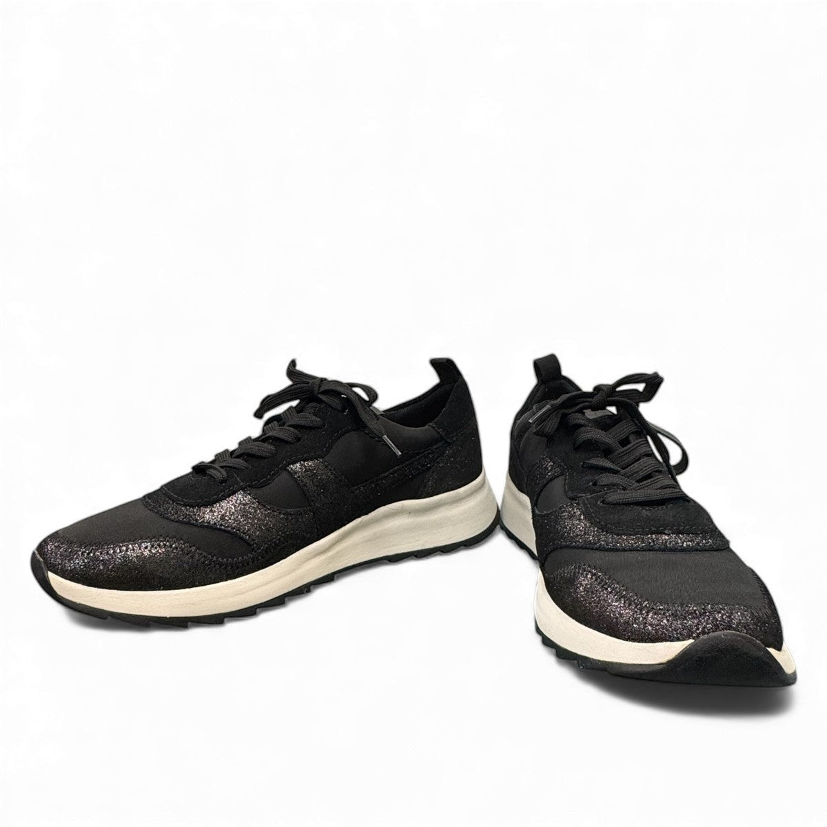 Clarks DashLite Jazz black leather sneaker with glitter accents and a lightweight white EVA midsole. front view.