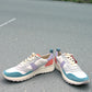 Clarks DashLite Jazz sneakers in lilac, teal, and coral leather with a retro jogger design and lace-up front. photo of the front.