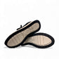 Clarks DashLite Jazz black leather sneaker with glitter accents and a lightweight white EVA midsole. bottom view.