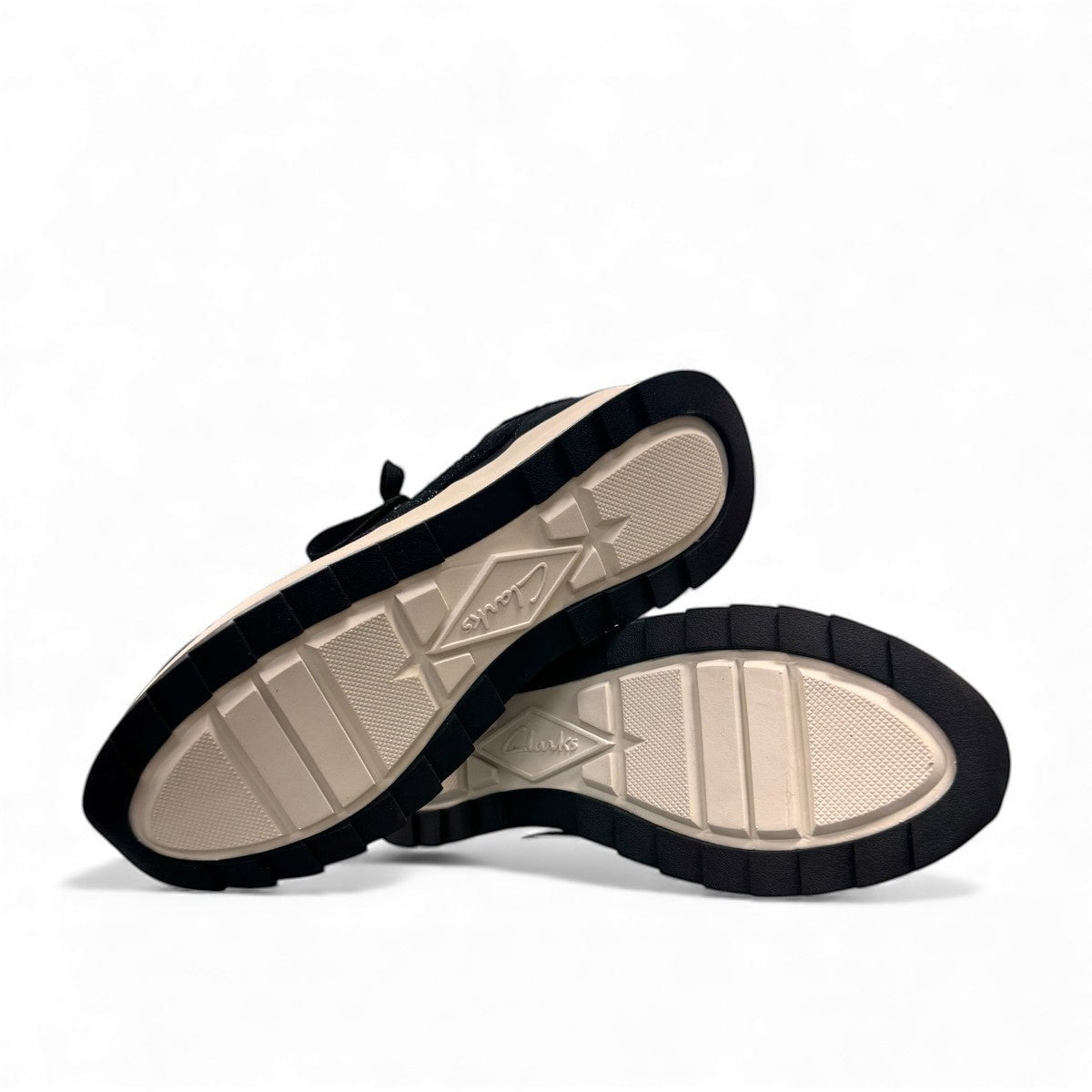 Clarks DashLite Jazz black leather sneaker with glitter accents and a lightweight white EVA midsole. bottom view.