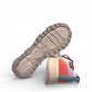 Clarks DashLite Jazz sneakers in lilac, teal, and coral leather with a retro jogger design and lace-up front. photo of the bottom.