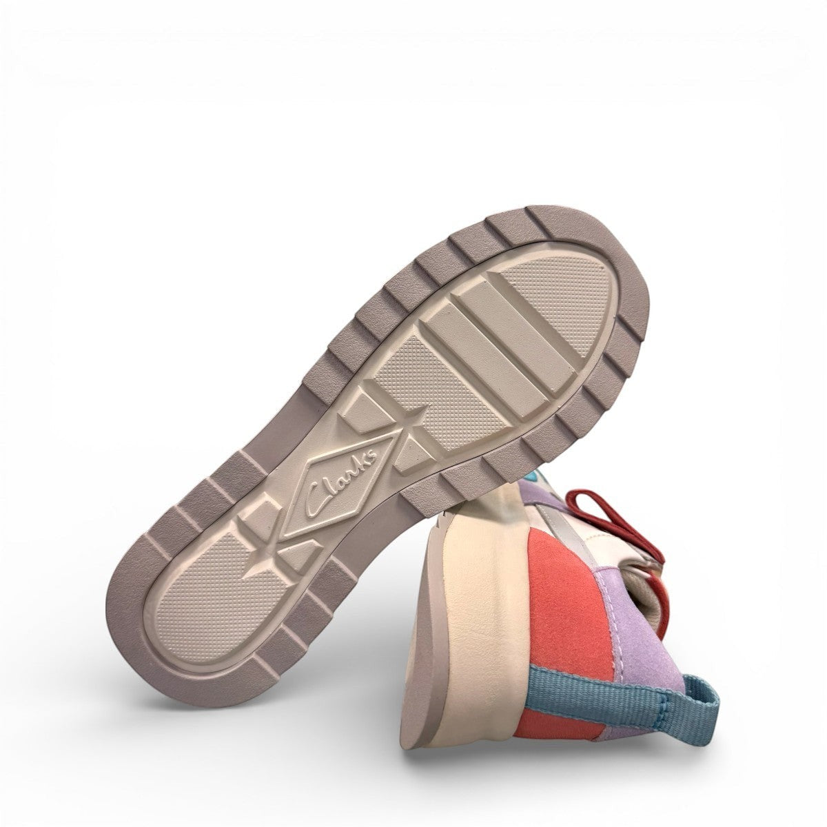 Clarks DashLite Jazz sneakers in lilac, teal, and coral leather with a retro jogger design and lace-up front. photo of the bottom.