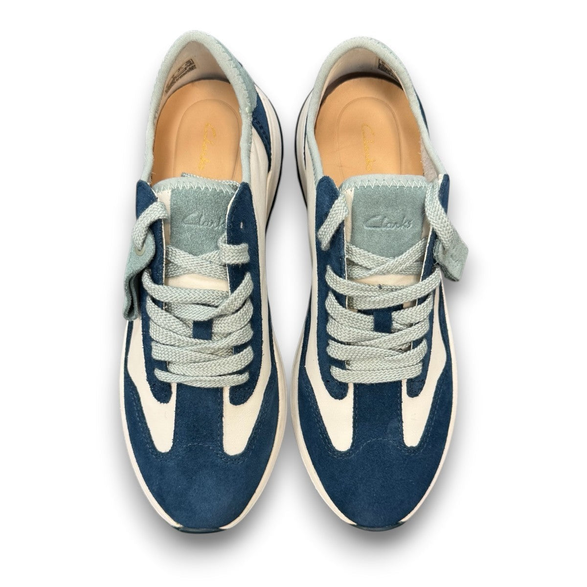 Clarks Dashlite Lo sneakers in teal leather with a retro jogger silhouette and gum sole. photo of the  top.