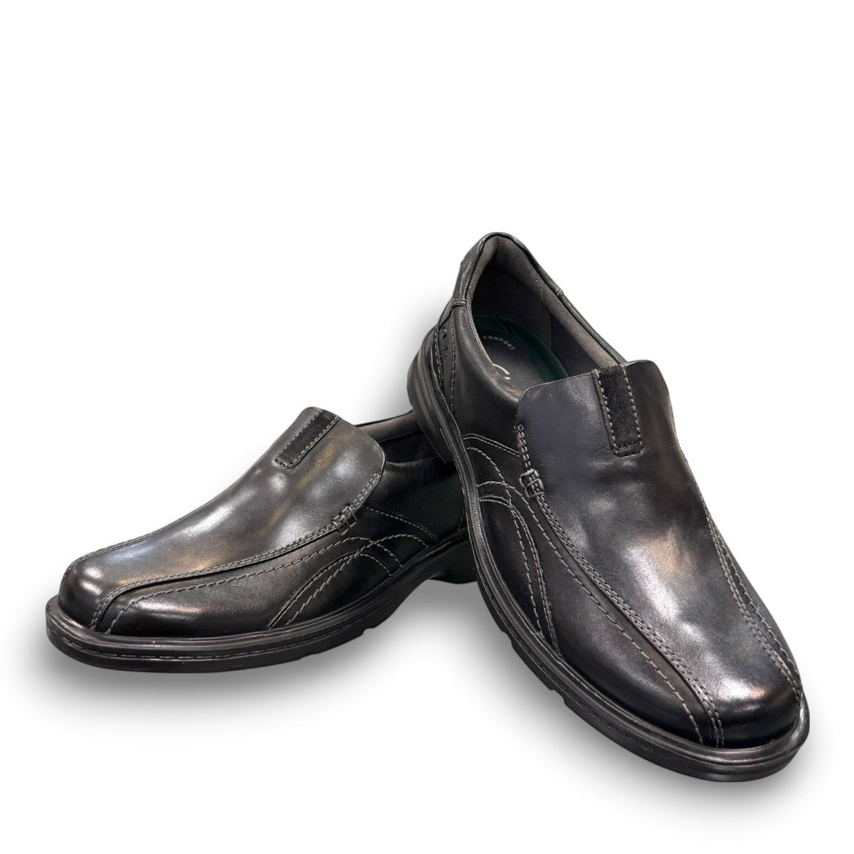 Clarks Gessler Step black leather slip-on casual shoe with a lightweight EVA sole and stitched detail. photo of the front.