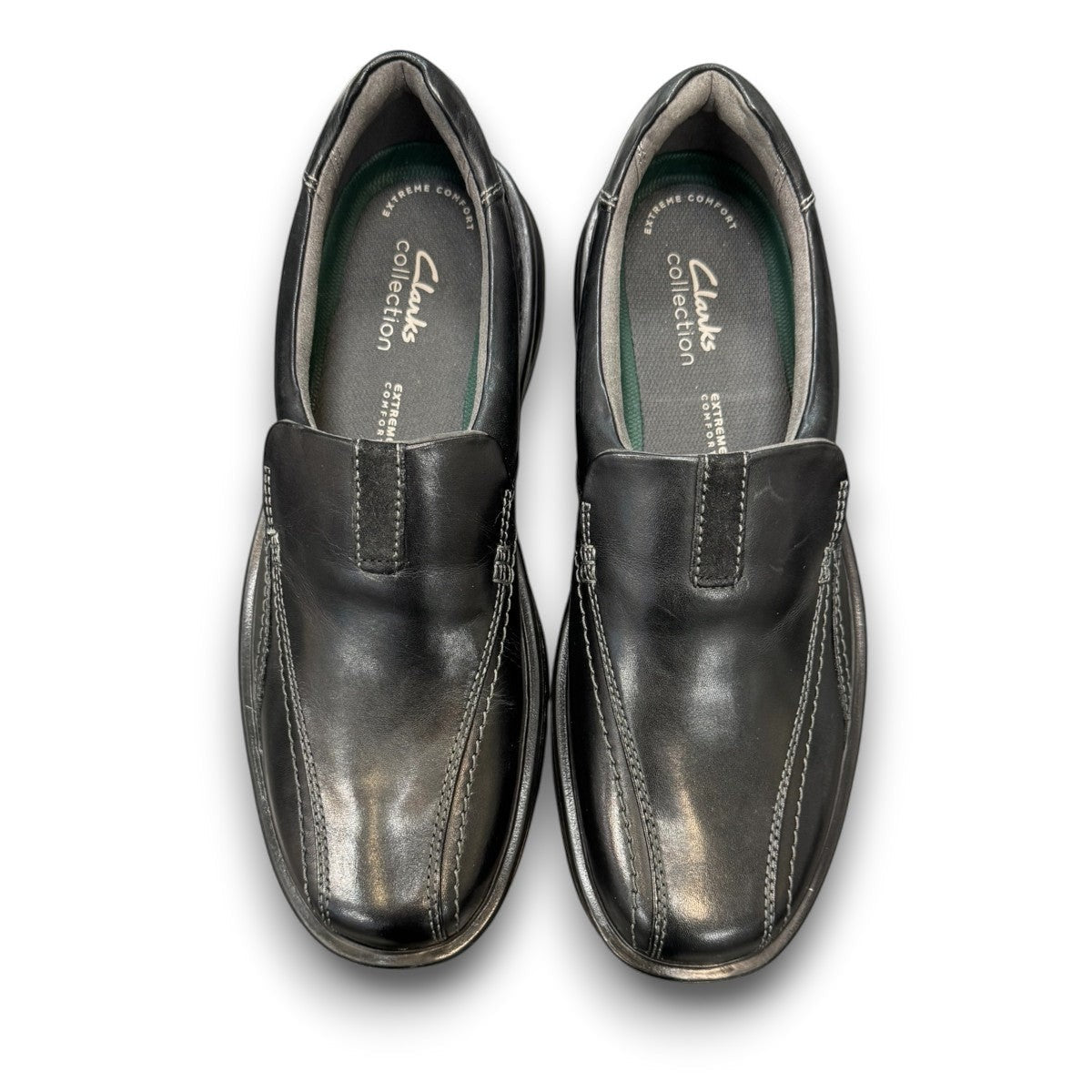 Clarks Gessler Step black leather slip-on casual shoe with a lightweight EVA sole and stitched detail. photo of the top.