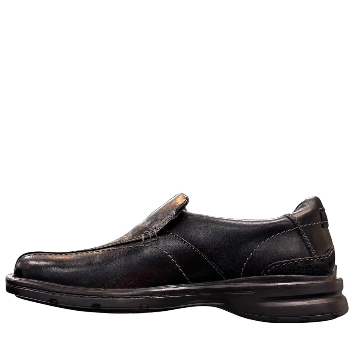 Clarks Gessler Step black leather slip-on casual shoe with a lightweight EVA sole and stitched detail. photo of the left side.