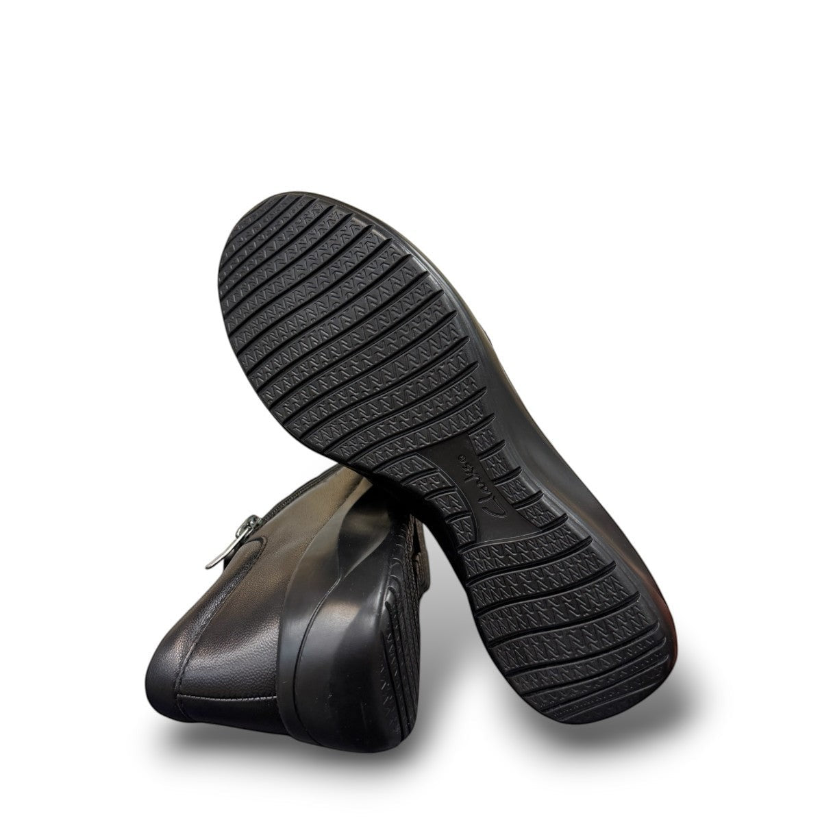 Sina Footwear Clarks Kaetlyn Mila black leather slip-on shoe with side zip and comfortable foam footbed.
photo of the bottom.