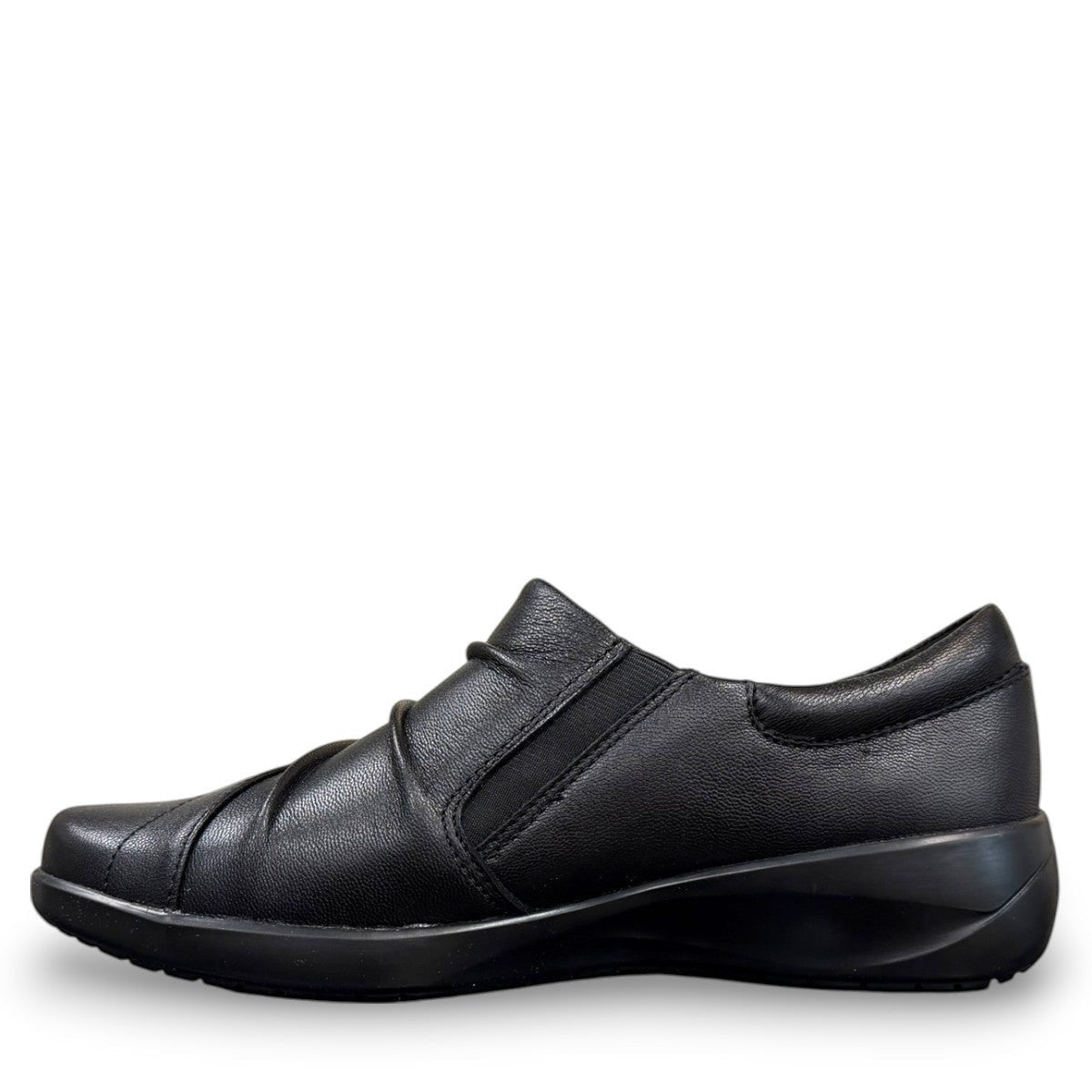 Sina Footwear Clarks Kaetlyn Mila black leather slip-on shoe with side zip and comfortable foam footbed.
photo of the left side.