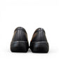Clarks Kaetlyn Rhea black leather slip-on shoe with stretch panels and a comfortable rubber sole. photo of the back.