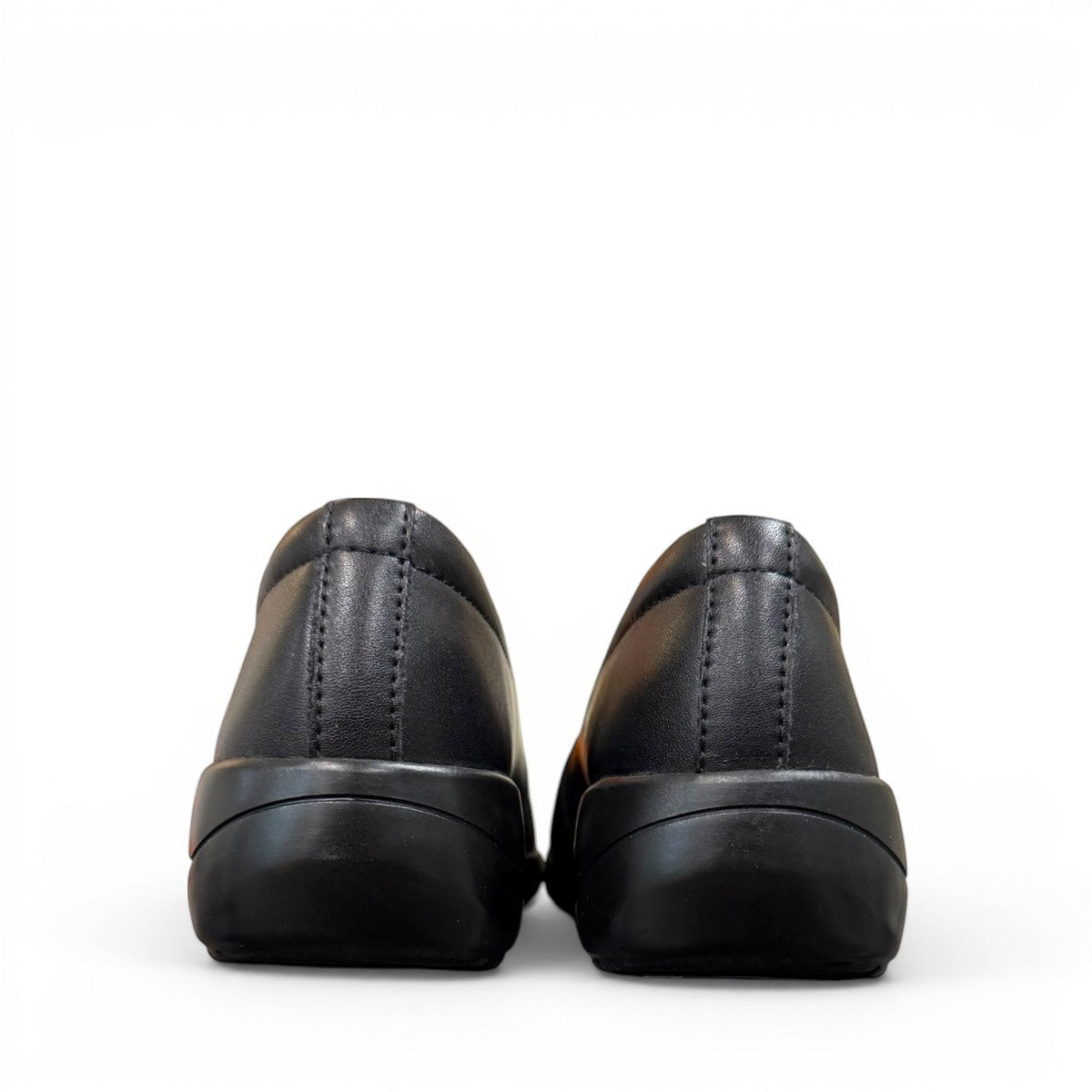 Clarks Kaetlyn Rhea black leather slip-on shoe with stretch panels and a comfortable rubber sole. photo of the back.