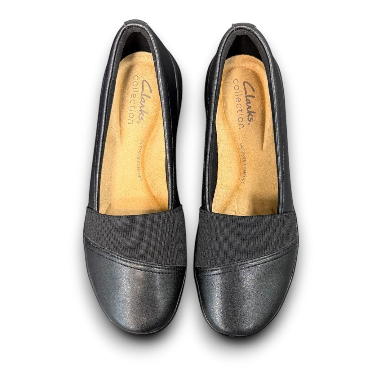 Clarks Kaetlyn Rhea black leather slip-on shoe with stretch panels and a comfortable rubber sole. photo of the top.