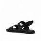 Clarks Karsea Strap black leather sandals with adjustable ankle strap and comfortable flat sole. back view.