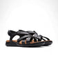 Clarks Kitly Go black leather strappy sandals with adjustable straps and a cushioned footbed. front view.