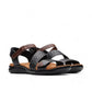 Clarks Kitly Way black leather sandal with laser-cut details, adjustable straps, and cushioned footbed. front view.