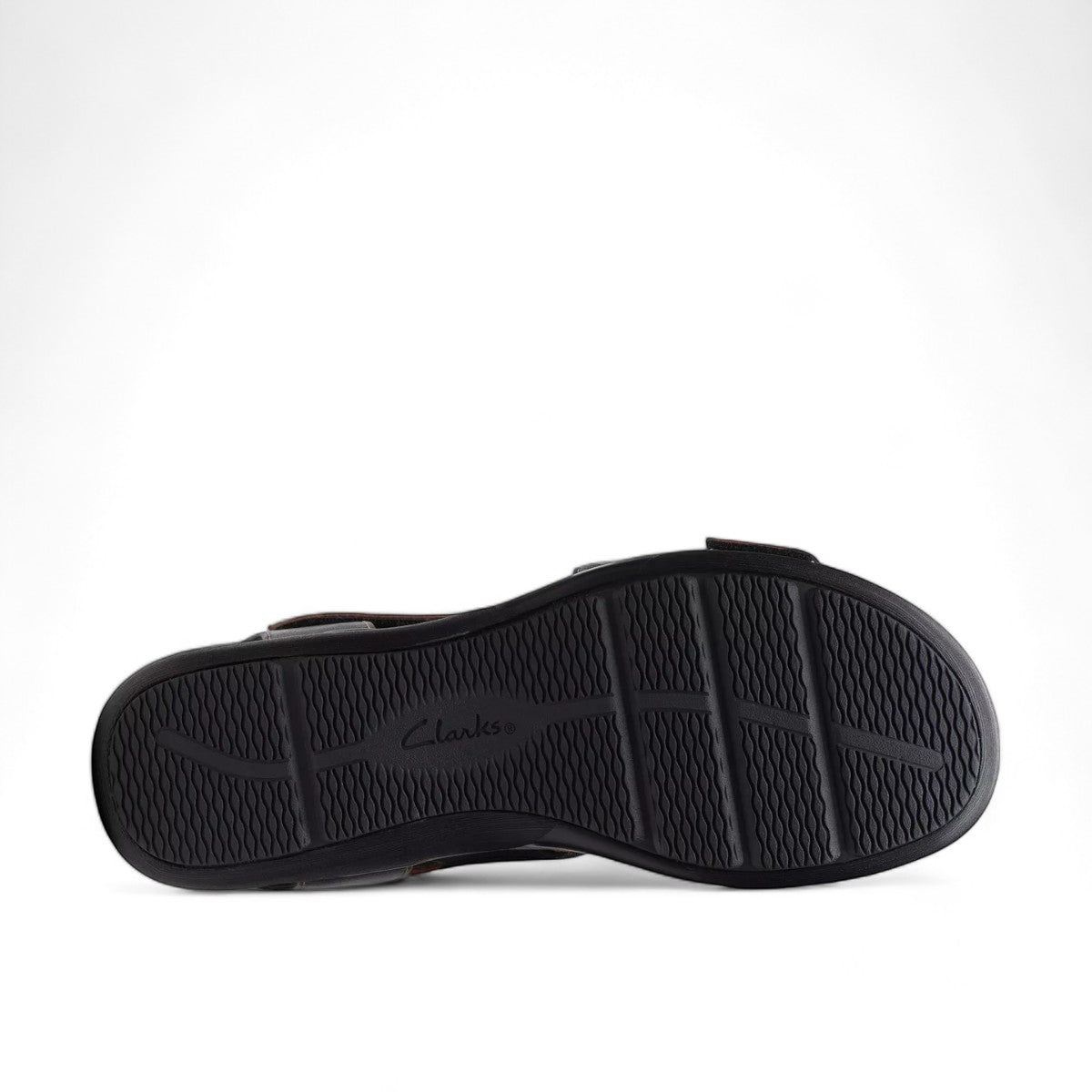 Clarks Kitly Way black leather sandal with laser-cut details, adjustable straps, and cushioned footbed. bottom view.