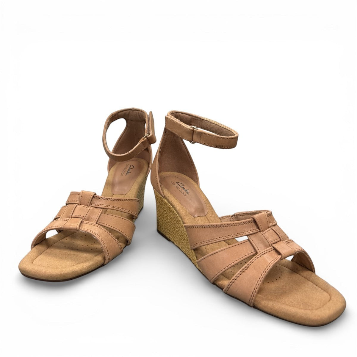 Clarks Kyarra Joy warm beige leather wedge sandal with ankle strap and woven jute heel. front view.