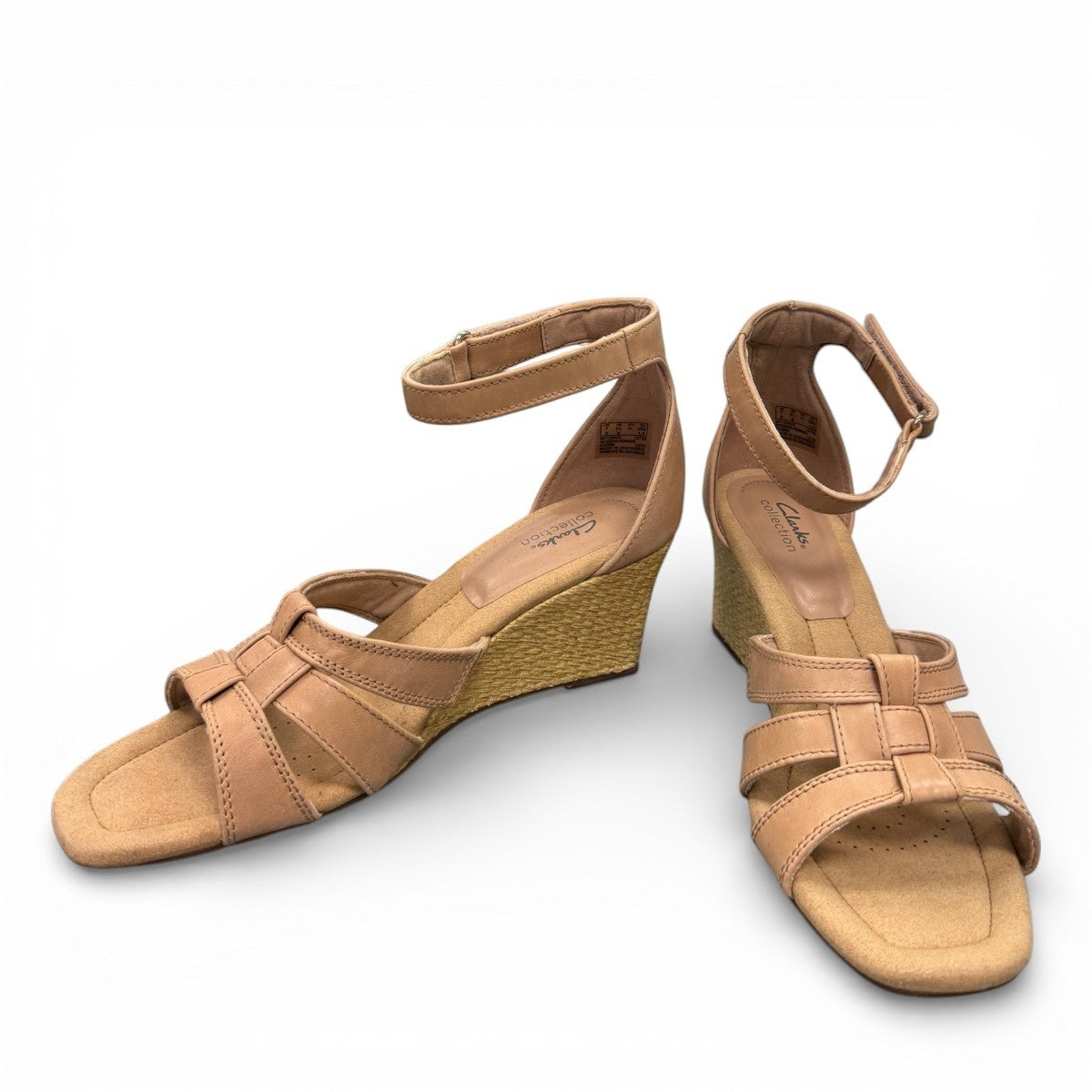 Clarks Kyarra Joy warm beige leather wedge sandal with ankle strap and woven jute heel. front view.