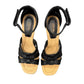 Clarks Kyarra Joy black leather wedge sandals with ankle strap and textured heel. top view.