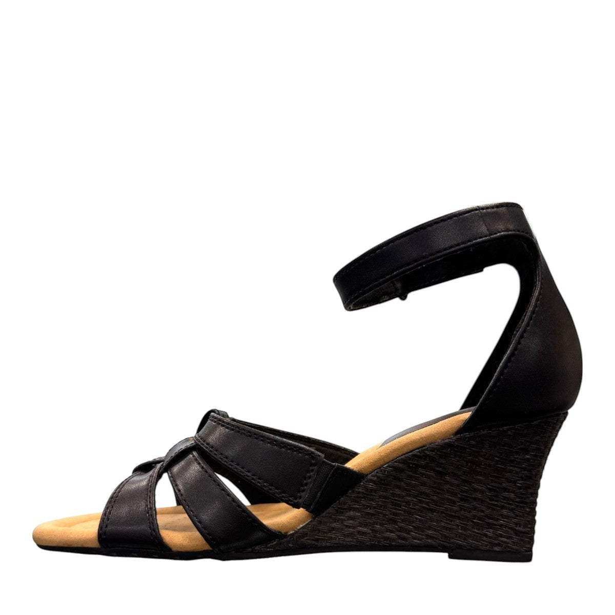 Clarks Kyarra Joy black leather wedge sandals with ankle strap and textured heel. left view.