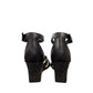 Clarks Kyarra Joy black leather wedge sandals with ankle strap and textured heel. back view.