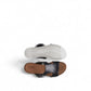 Clarks Lizby Ease black leather slide sandals with adjustable buckle and cork-effect wedge platform sole. top view.
