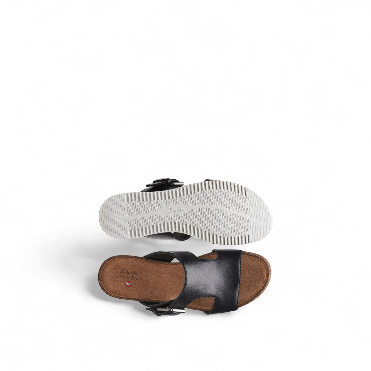 Clarks Lizby Ease black leather slide sandals with adjustable buckle and cork-effect wedge platform sole. top view.