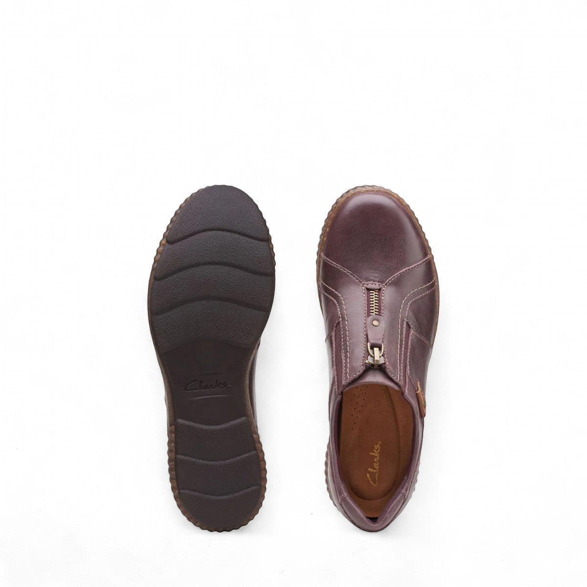 Clarks Magnolia Zip burgundy leather slip-on shoe with front zipper, padded collar, and textured sole. top view.