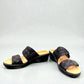 Clarks Merliah Charm black slide sandal with textile upper, and cushioned EVA sole. front view.