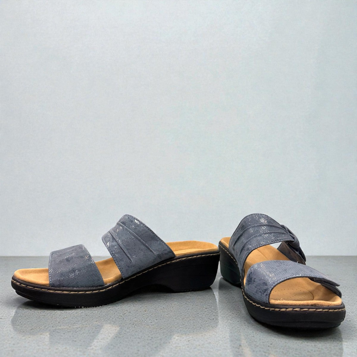 Clarks Merliah Charm blue grey slide sandal with adjustable straps, and cushioned sole. front view.