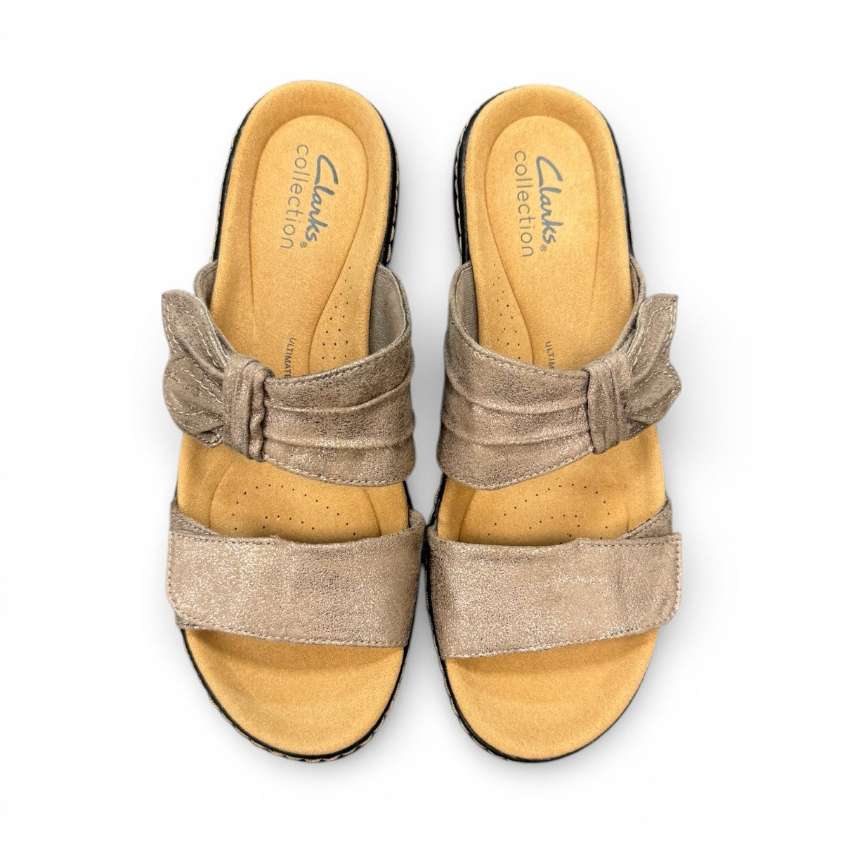Clarks Merliah Charm taupe metallic slide sandal with adjustable grip tape closure. top view.