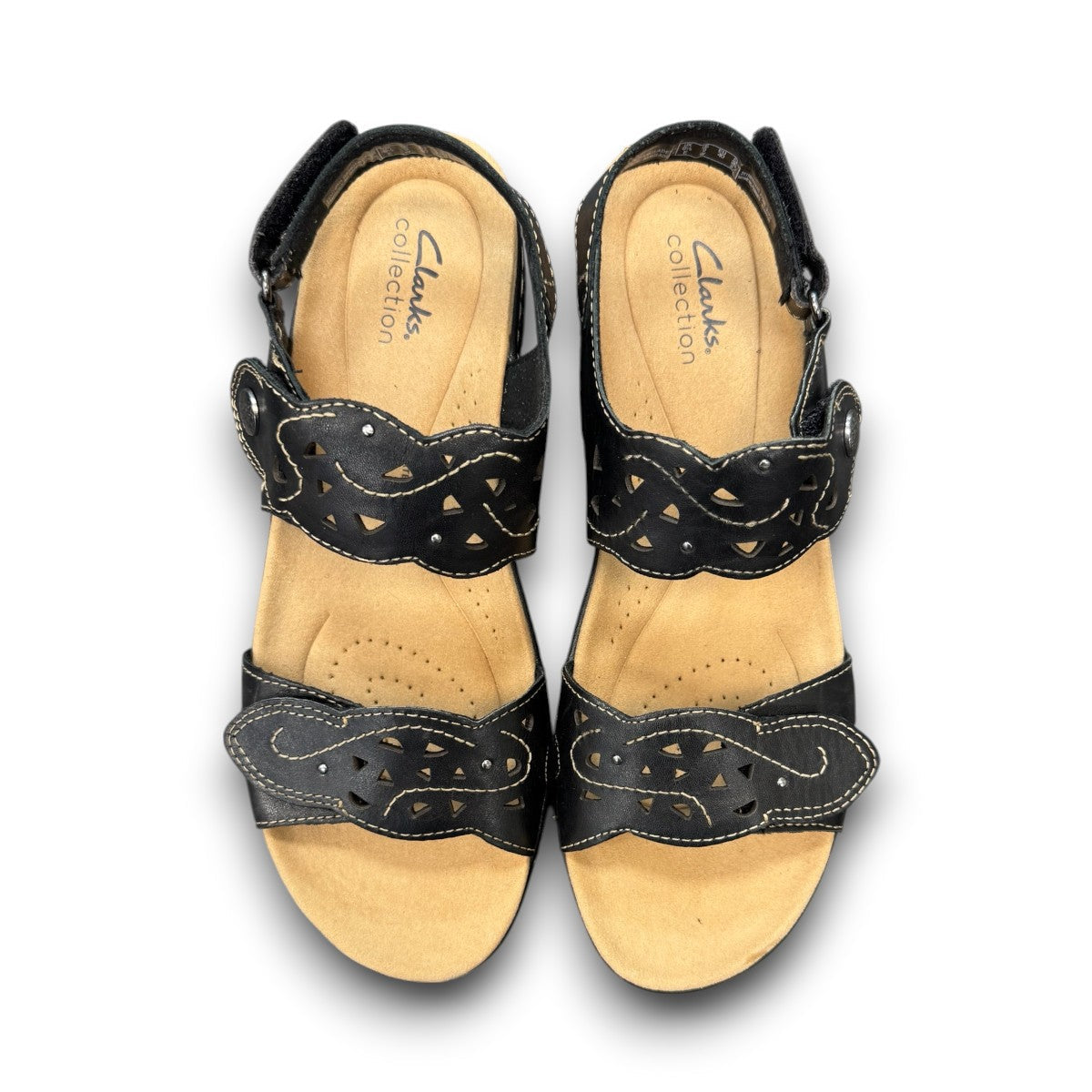 Clarks Merliah Dove black leather wedge sandals with adjustable straps and perforated detailing. top view.
