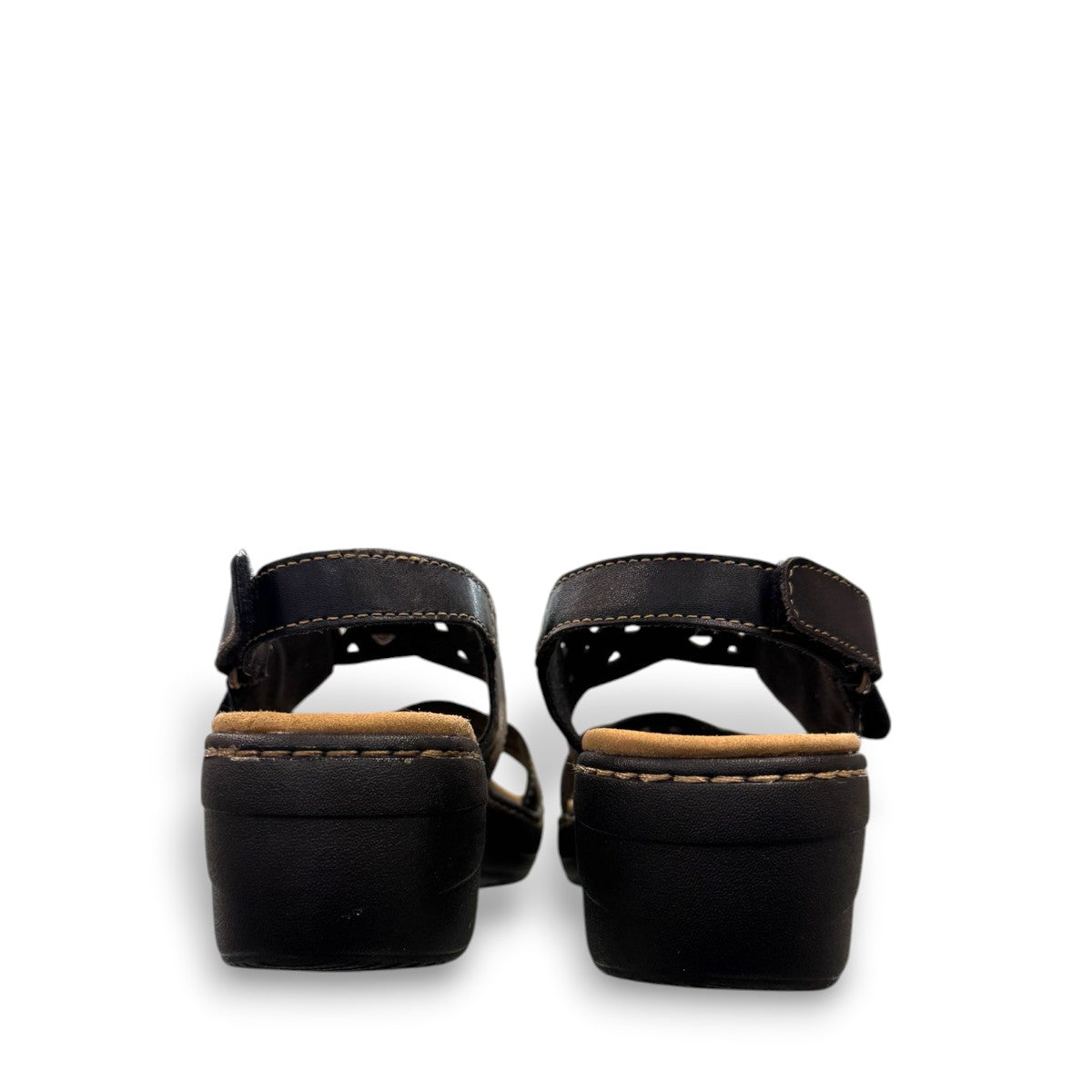 Clarks Merliah Dove black leather wedge sandals with adjustable straps and perforated detailing. back view.