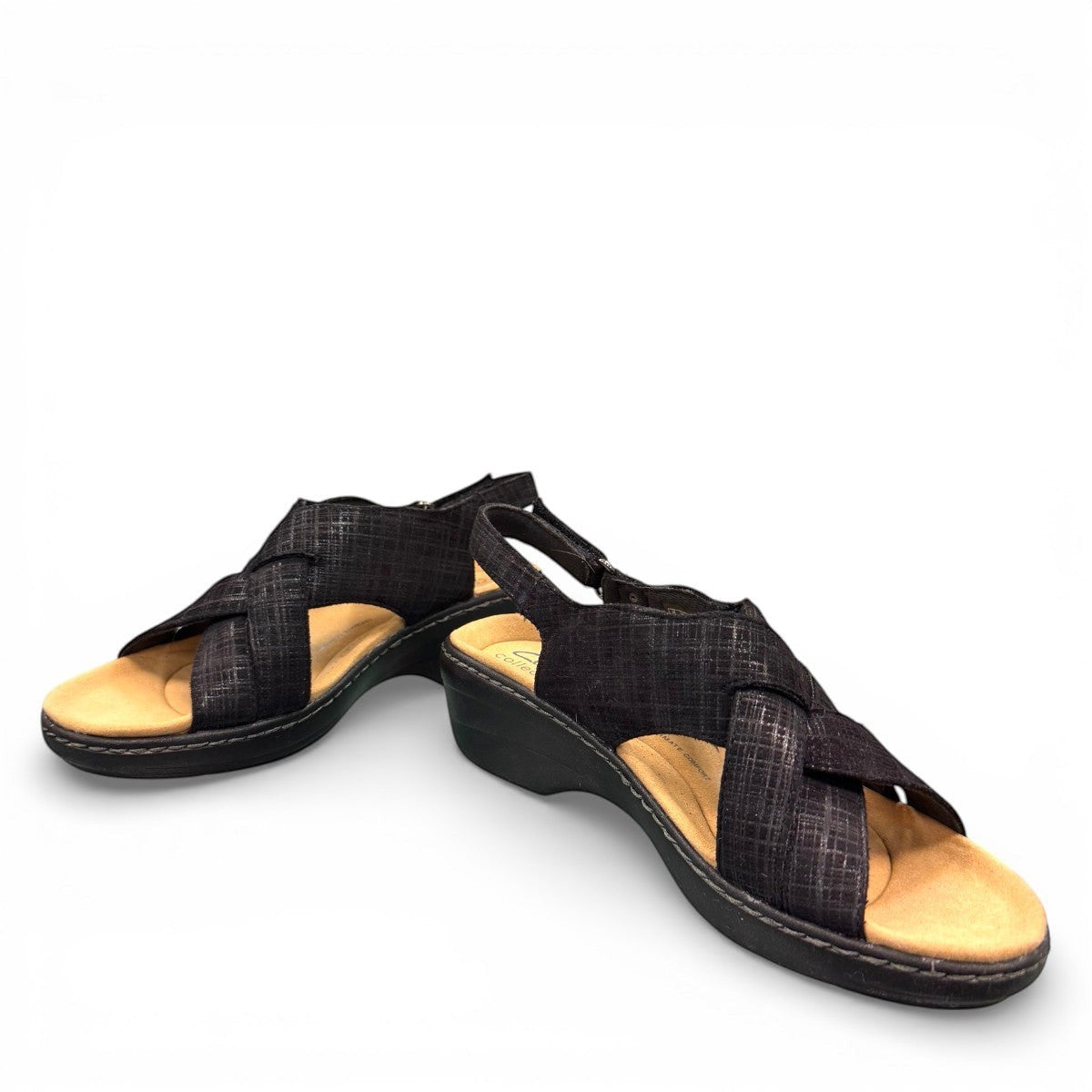 Clarks Merliah Echo black leather wedge sandal with cushioned footbed and riptape closure. front view.