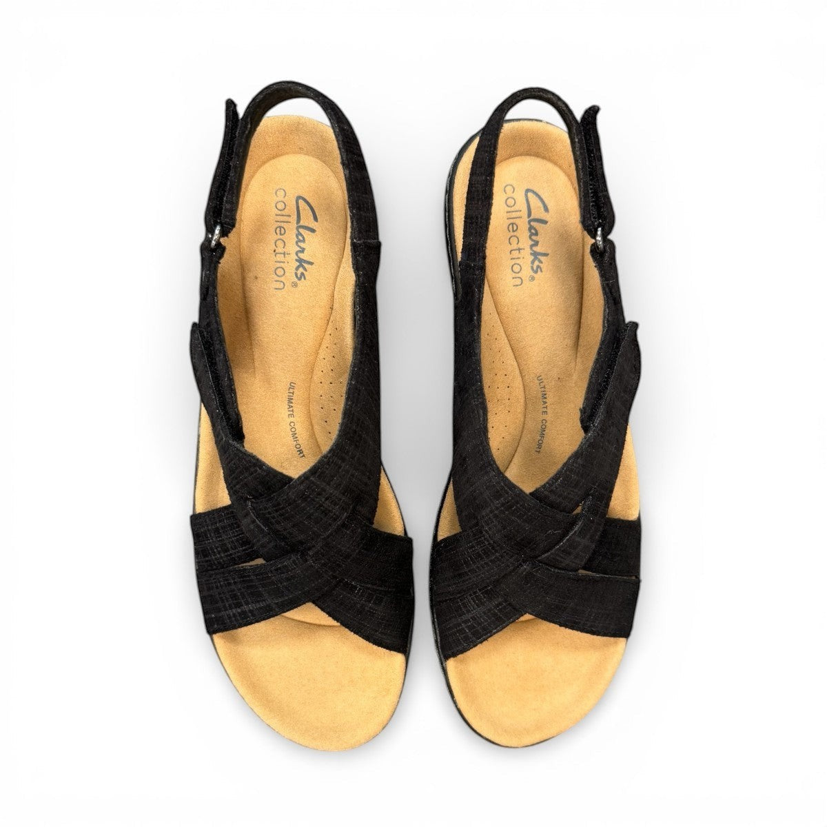 Clarks Merliah Echo black leather wedge sandal with cushioned footbed and riptape closure. top view.