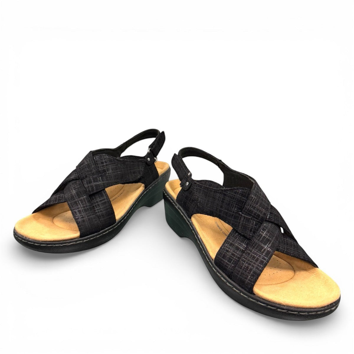 Clarks Merliah Echo black leather wedge sandal with cushioned footbed and riptape closure. front view.