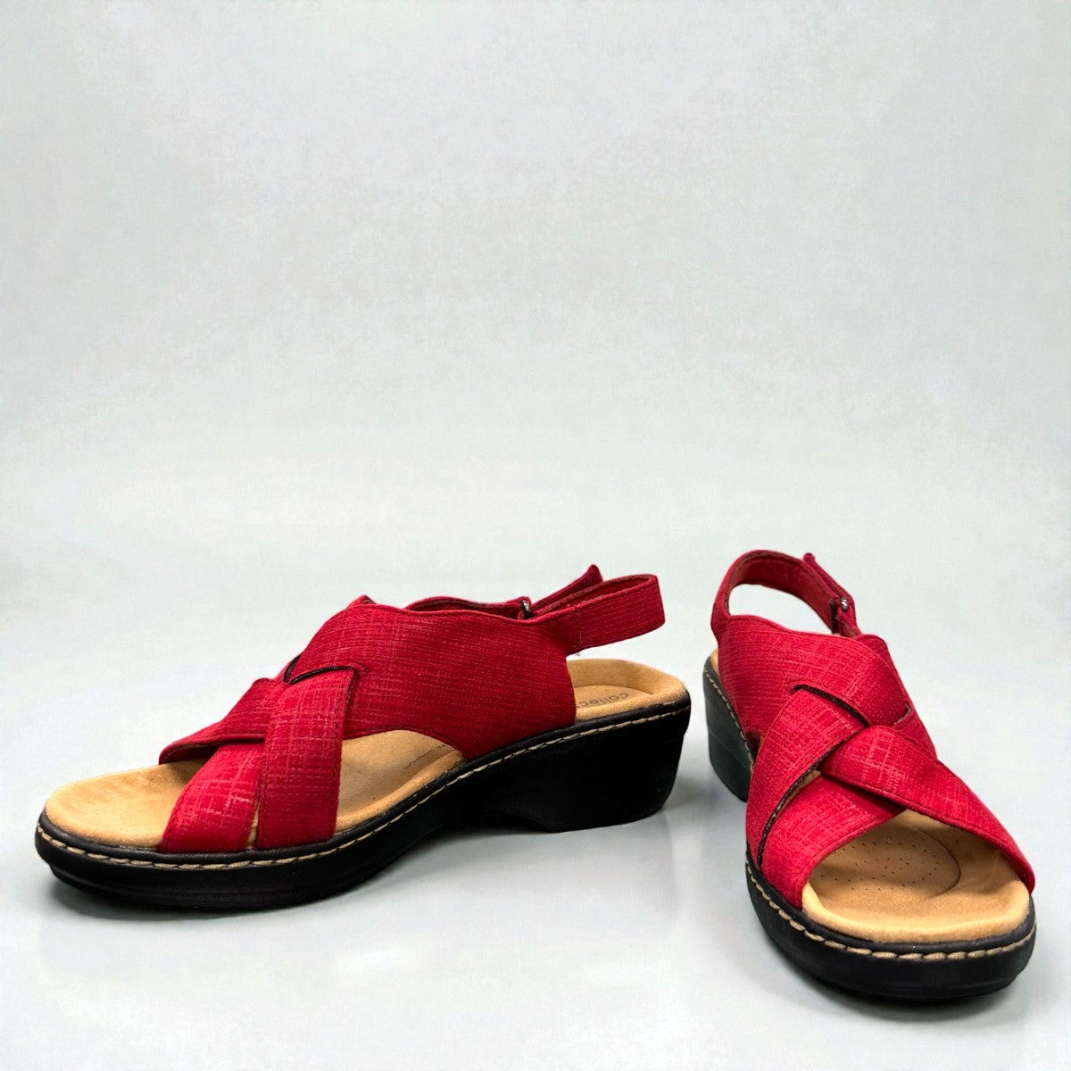 Clarks Merliah Echo red suede wedge sandals with riptape closure and cushioned footbed.front view.
