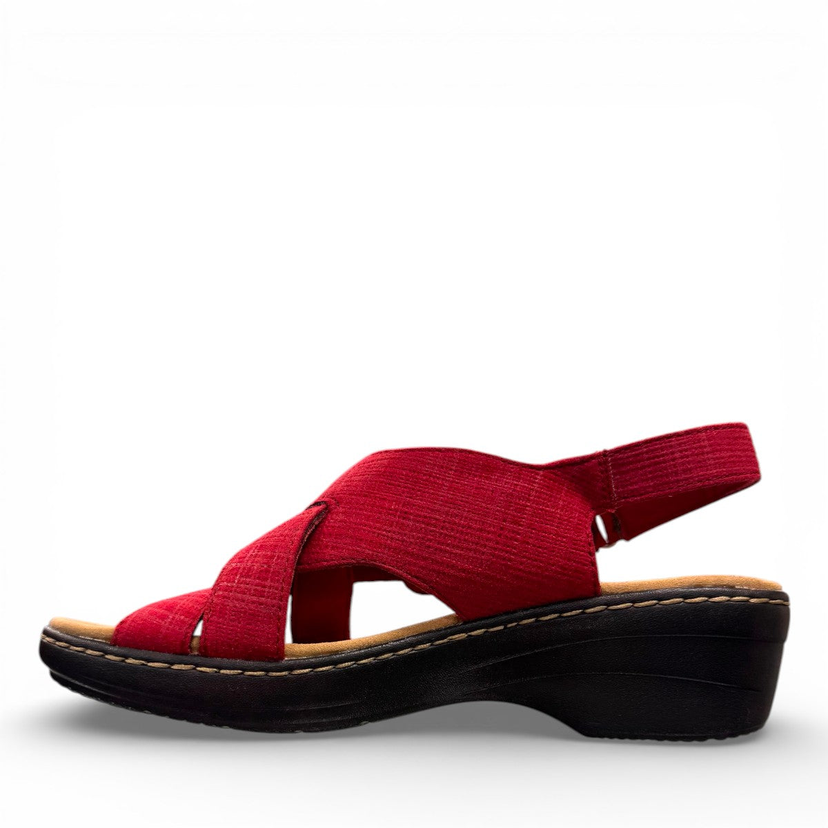 Clarks Merliah Echo red suede wedge sandals with riptape closure and cushioned footbed. left view.