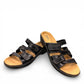 Clarks Merliah Karli black leather sandal with mid-height heel, riptape closure, and comfort footbed. front view.
