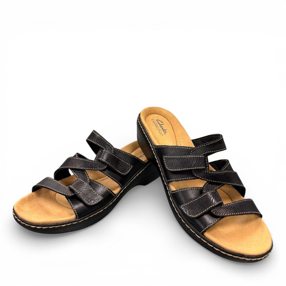 Clarks Merliah Karli black leather sandal with mid-height heel, riptape closure, and comfort footbed. front view.