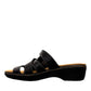Clarks Merliah Karli black leather sandal with mid-height heel, riptape closure, and comfort footbed. left view.