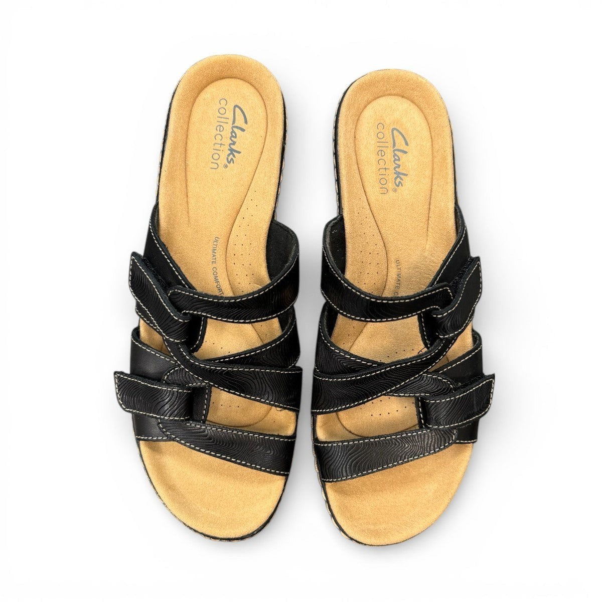 Clarks Merliah Karli black leather sandal with mid-height heel, riptape closure, and comfort footbed. top view.