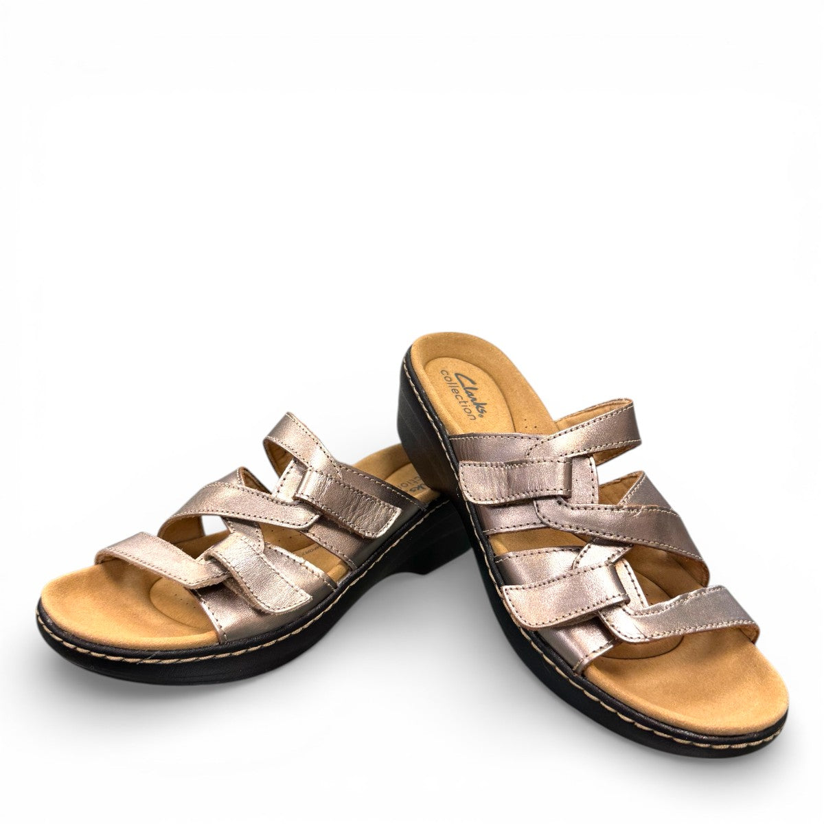 Clarks Merliah Karli metallic leather sandal with adjustable riptape straps and a mid-height heel.
front view.